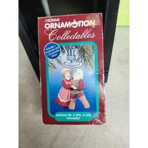 Noma motorized tree ornament. Mr. and Mrs. Claus dancing